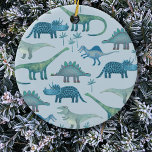 Ornamento De Cerâmica Dinossauros Azuis Cutes<br><div class="desc">Muitos dinossauros azuis,  Tyrannosaurus rex,  Spinossauro,  Stegossauro,  Diplodocuments e Tricerátops num fundo azul. Perfeito para paleontólogos. Arte original de Nic Squirrell.</div>