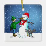 Ornamento De Cerâmica Edifício Snowman<br><div class="desc">O menino construiu um boneco de neve que seu cachorro se sustenta e urina enquanto o menino dá ao boneco de neve um nariz de cenoura.</div>