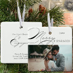 Ornamento De Cerâmica Feliz e fotografia engajada e caligrafia elegante<br><div class="desc">Feliz e ornamento de fotos de Natal Envolvido que você pode personalizar com sua foto favorita e texto personalizado. Design de tipografia elegante com caligrafia suave e fácil de editar para um casal engajado. Este ornamento de feriado é marcado com Feliz e Engajado de um lado e texto editável do...</div>