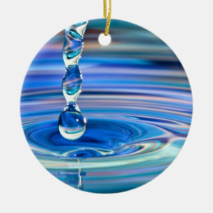 Ornamento De Cerâmica Fluxo claro das gotas da água azul
