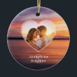 Ornamento De Cerâmica Foto E Nomes Do Casal De Coração Laranja<br><div class="desc">Apresentando uma foto quente do pôr do sol por Destei em tons laranja e roxos, esta design inclui um modelo de foto em forma de coração para sua foto favorita do casal. Abaixo do coração, os nomes podem ser adicionados com uma superposição desbotada atrás deles. Uma forma romântica e eterno...</div>