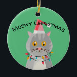 Ornamento De Cerâmica Gato de Tabuleiro Bonito em Santa Hat<br><div class="desc">Um gato adorável vestido de Natal vestindo um chapéu de Papai Noel. O ornamento diz Meowy Christmas.</div>