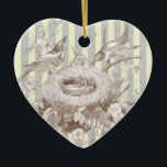 Ornamento De Cerâmica La Petite Famille sobre fundo azul e creme<br><div class="desc">Uma bela imagem vintage,  de dois pais dotando-os,  alimentando seus filhotes no ninho,  que foi banhado em um ouro antigo e então colocado em um chão azul e creme no fundo. © Wicktly Lovely</div>