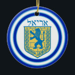Ornamento De Cerâmica Leão de Judah Emblem Ariel Hebrew<br><div class="desc">O ornamento cerâmico redondo com uma imagem, em ambos os lados, de um leão azul e amarelo de Judah emblem branco com bordas azuis claras e azuis escuras e de "Ariel" em hebraico, em letras azuis sobre ele. Veja toda a coleção de Pedidos de Hanukkah na categoria HOME na seção...</div>