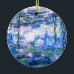 Ornamento De Cerâmica Lírios de Água Rosa Monet<br><div class="desc">Um ornamento de lírios cor-de-rosa monet com lindos lírios de água rosa flutuando em um lago azul calmo com almofadas de lírios. Um presente de Monet excelente para fãs do impressionismo e da arte francesa. Inimpressionismo sereno na natureza com lindas flores e paisagem de lagoas cênicas.</div>