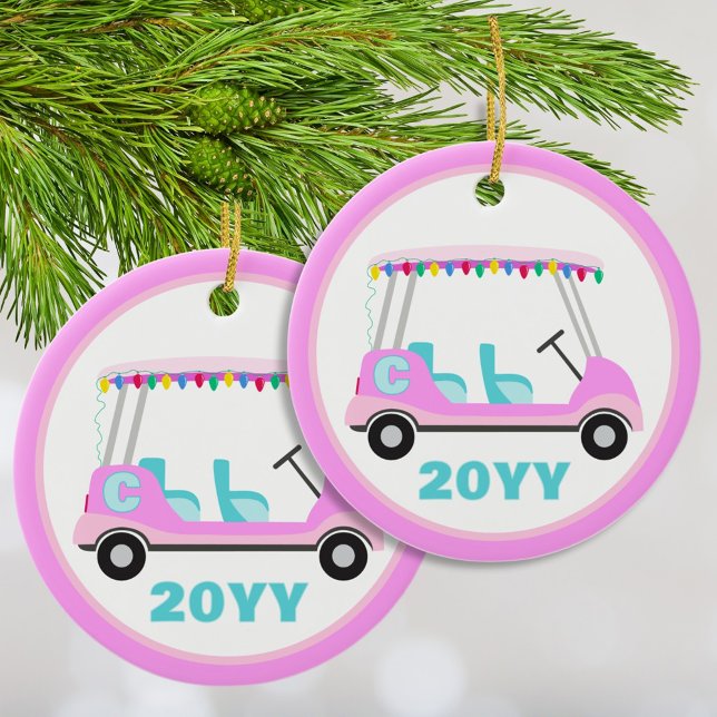 Ornamento De Cerâmica Luzes de Férias de Golfe Rosa Personalizadas (Fun cute and festive pink golf cart ornament personalized with your initial and the year. )
