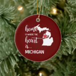 Ornamento De Cerâmica Michigan home is where the heart is<br><div class="desc">Michigan home is where the heart is - in mixed script and uppercase 
white font with the silhouette of the state boundaries and a red heart. Set on Christmas red. Personalize one side with 
your name or message in white script font.</div>