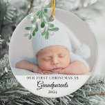 Ornamento De Cerâmica Nosso Primeiro Natal Como Foto De Avós<br><div class="desc">O Primeiro Ornamento de Natal deste lindo Avô é decorado com conchas de aquarela. Facilmente personalizável com a foto, o nome e o ano do seu bebê. Use a Ferramenta Design para alterar o tamanho, o estilo ou a cor do texto. Porque nós criamos a nossa trabalho de arte, você...</div>