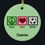 Ornamento De Cerâmica Peace Love Soccer Custom Christmas<br><div class="desc">Cute soccer Christmas ornament featuring a peace sign,  heart,  and a soccer ball on cool green with your personalization under PEACE LOVE SOCCER. Custom made with your text in black at the bottom.</div>