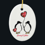 Ornamento De Cerâmica Penguin engagement gift<br><div class="desc">Personalised penguin engagement gift hanging decoration.
The perfect way to congratulate a couple who have just got engaged!
It includes space for a personalised message and the name of the couple, as well as the year of their engagement.
Matching cards are also available in this illustrated design.</div>