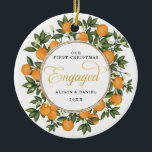 Ornamento De Cerâmica Primeiro Natal Envolvido Citrus Greenery<br><div class="desc">Este Enfeites de natal inspirado pelos citros apresenta laranjas pintadas à mão lindas e um verde-azul exuberante. Excelente para um casamento de verão! Os campos de texto são totalmente editáveis, exceto a palavra "Engaged". Basta remover esta palavra clicando no botão excluir e adicionar seu próprio texto se você precisar de...</div>