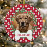 Ornamento De Cerâmica Red Paw Print Dog Fotada Fúria de Natal<br><div class="desc">Celebre seu amigo peludo nesta temporada de festas com esta foto personalizada de cão de pata vermelha foto da coroa de Natal ornamento. Apresentando uma coroa festiva enfeitada com folhas verdes e bagas vermelhas ao redor da foto do seu animal de estimação, esta ornamentação adiciona um toque personalizado à sua...</div>