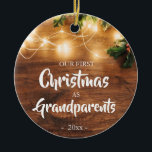 Ornamento De Cerâmica Rustic First Christmas as Grandparents<br><div class="desc">Ornaments for Grandparents cheering at their first Christmas as Grandparents. Rustic look with festive greenery and white wood background.</div>