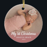 Ornamento De Cerâmica Script Calligrapy Baby's First Christmas Photo<br><div class="desc">This round Christmas ornament offers a baby's first Christmas theme. The text "My 1st Christmas" appears in white over top of the photo. Custom text allows you to add the name and year of your newborn.</div>