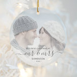 Ornamento De Cerâmica Script de Cinza Personalizada de Fotografia do Nat<br><div class="desc">Comemore o primeiro Natal do seu casamento com este belo ornamento moderno do keepsasasaame. O texto da cinza de carvão diz "Nosso primeiro Natal como Sr. & Sra.", com as palavras "Sr. & Sra." em um roteiro elegante com flores antes e depois. Substitua a imagem de exemplo por sua foto...</div>