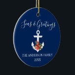 Ornamento De Cerâmica Seas and Greetings Poinsettia Anchor PHOTO BACK<br><div class="desc">Stylish Calligraphy Script Nautical Seas & Greetings Navy Blue Ornament. Anchor topped with Watercolor Floral including red poinsettias,  pine cones and other beautiful winter greenery. Photo Back.</div>