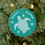 Ornamento De Cerâmica Season's Greetings Cute Xmas Turtle Personalized<br><div class="desc">Adorable blue Christmas ornament featuring a cute turtle,  snowflakes,  and the words Season's Greetings. On the back of the back of the ornament it reads From the,  then add your own name to personalise. All the wording on this festive ornament is customisable.</div>