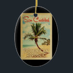 Ornamento De Cerâmica Viagens vintage de Árvore Palm San Cristobal<br><div class="desc">Um impressão de arte da República Dominicana de San Cristobal,  do século médio único,  no estilo de poster viagens vintage. Ele apresenta uma palmeira curva na praia arenosa com oceano sob um céu azul nublado.</div>