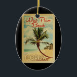 Ornamento De Cerâmica Viagens vintage de Palm Beach<br><div class="desc">Uma impressão de arte moderna de West Palm Beach,  na Flórida,  do século médio,  em estilo viagens vintage. Ele apresenta uma palmeira curva na praia arenosa com oceano sob um céu azul nublado.</div>