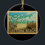 Ornamento De Cerâmica Viagens vintage de praia de Daytona<br><div class="desc">Esta design do cartão postal da praia de Daytona apresenta uma praia arenosa com uma bela água turquesa oceânica e acima do mar,  um céu azul com nuvens brancas onduladas. No estilo viagens vintage.</div>