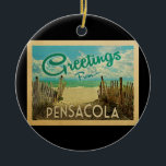 Ornamento De Cerâmica Viagens vintage de Praia de Pensacola<br><div class="desc">Esta design do cartão postal de Pensacola apresenta uma praia arenosa com uma bela água turquesa oceânica e acima do mar,  um céu azul com nuvens brancas onduladas. No estilo viagens vintage.</div>