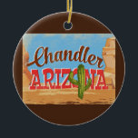 Ornamento De Cerâmica Viagens vintage do deserto da Arizona Chandler<br><div class="desc">Design de Arizona neoviagens vintage Chandler no estilo de desenho animado com o deserto,  um cacto e rochas. Azul,  marrom e vermelho com cacto verde.</div>