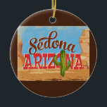 Ornamento De Cerâmica Viagens vintage do Deserto de Cartoons de Arizona<br><div class="desc">Design neo viagens vintage de Arizona de de de Sedona em engraçada desenho animado com estilo retrógrado do deserto,  cacto e rochas. Azul,  marrom e vermelho com cacto verde.</div>