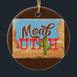 Ornamento De Cerâmica Viagens vintage do Deserto do Moab Utah<br><div class="desc">Moab Utah neo viagens vintage na design de desenho animado com estilo retrô apresentando o deserto,  um cacto e rochas. Azul,  marrom e vermelho com cacto verde.</div>