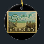Ornamento De Cerâmica Viagens vintage Mendocino Beach<br><div class="desc">Esta design do cartão postal de Mendocino apresenta uma praia arenosa com uma bela água turquesa oceânica e acima do mar,  um céu azul com nuvens brancas e onduladas. No estilo viagens vintage.</div>