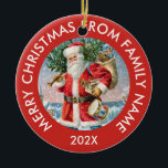 Ornamento De Cerâmica Vintage Santa Claus<br><div class="desc">Vintage Papai Noel com vergreens e presentes de Natal e tipografia verde personalizável. Feliz Natal do nome da família e do ano.</div>