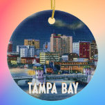 Ornamento De Cerâmica Vintage Tampa Florida Skyline<br><div class="desc">Ilustração de um cartão postal vintage dos anos 40 da Tampa,  linha do horizonte da Flórida à noite,  olhando através da baía. As palavras "Tampa Bay" estão no fundo em uma fonte de estilo de deco de arte.</div>