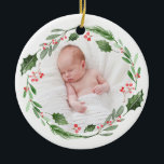 Ornamento De Cerâmica Watercolor Wreath Baby's First Christmas Photo<br><div class="desc">Adicione um sotaque personalizado à sua árvore de Natal com o primeiro ornamento de fotos de Natal deste bebê. Apresenta ilustrações em aquarela de verde,  colas e bagas. Personalize adicionando sua foto,  nome e data. Este enfeite de fotos de feriado também será perfeito como presente de Natal.</div>