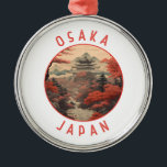 Ornamento De Metal Círculo Retro Distante Osaka Japão<br><div class="desc">Osaka retro vetor viagem design. É conhecida pela sua arquitetura moderna,  vida noturna e comida de rua corajosa. O castelo de Osaka,  que sofreu vários restauros,  do shogunato do século XVI,  é o seu principal marco histórico.</div>