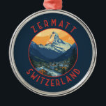 Ornamento De Metal Círculo Retrovisor da Suiça Zermatt<br><div class="desc">Zermatt retro vetor viagem design. Zermatt,  no cantão de Valais,  na Suiça meridional,  é um porto de montanha conhecido por esquiar,  escalar e caminhar.</div>