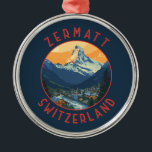 Ornamento De Metal Círculo Retrovisor da Suiça Zermatt<br><div class="desc">Zermatt retro vetor viagem design. Zermatt,  no cantão de Valais,  na Suiça meridional,  é um porto de montanha conhecido por esquiar,  escalar e caminhar.</div>