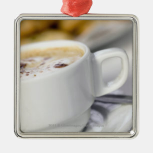 Ornamento De Metal Fim-acima de uma chávena de café