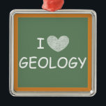 Ornamento De Metal I Love Geology<br><div class="desc">This product displays a picture of a chalkboard with "I [heart] GEOLOGY" in white font. It's a great gift for geology teachers,  college professors,  students,  and majors.</div>