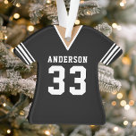 Ornamento Futebol Jersey Sports Team Uniform Black<br><div class="desc">Futebol Jersey Sports Team Uniform Black Ornament. Este ornamento de camisa de futebol é perfeito para qualquer um que pratica esportes escolares ou ama assistir esportes. Personalize este design personalizado com o seu próprio nome de equipe e número de camisa.</div>