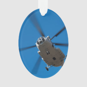 Ornamento Helicóptero que paira no céu azul