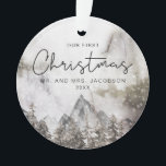 Ornamento Moody Winter Watercolor Mountain Primeiro Natal<br><div class="desc">Este Enfeites de natal apresenta uma modesta cor d'água na cena de inverno com uma fonte divertida escrita à mão. Este ornamento faz o presente perfeito para o casal recém-casado ou recém-engajado enquanto celebram juntos o seu primeiro Natal.</div>