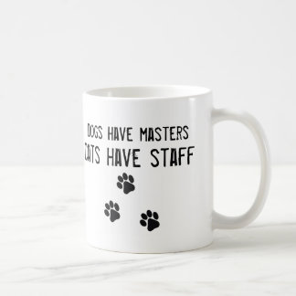 Os cães têm gatos do mestrado ter a caneca do