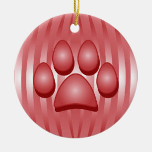 Osso de cão e enfeites de natal vermelhos da pata