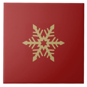Ouro do design do floco de neve no vermelho