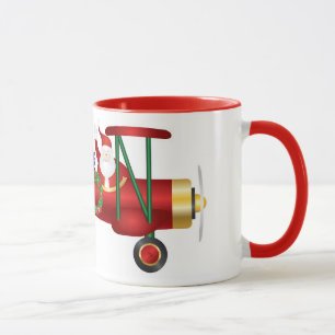 Papai Noel que acena no biplano com caneca dos