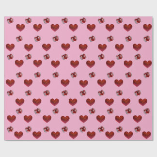 Papel de embrulho coração vermelho em fundo rosa a