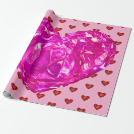 Papel de embrulho coração vermelho em fundo rosa a