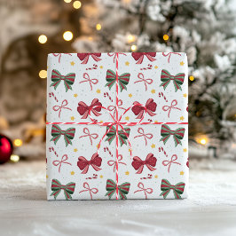 Papel de embrulho de Natal com laços vermelhos e v