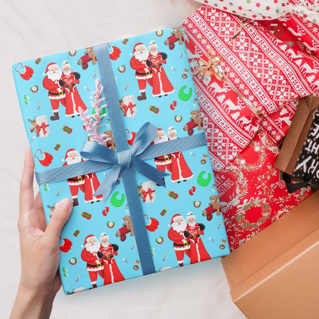Papel De Presente Chá de Bebê do Papai Noel e da Sra. Claus Azul (
Embrace holiday magic with Santa & Mrs. Claus Baby Shower Wrapping Paper. )
