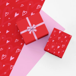 Papel De Presente Corações cor-de-rosa giro sobre fundo vermelho