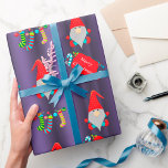 Papel De Presente Cute Gnomes Purple Christmas<br><div class="desc">A very cute Christmas wrap,  featuring a pattern of little Christmas gnomes in red hats on a purple background. They're surrounded by colorful,  striped Christmas stockings and 'Merry Christmas' greetings.</div>